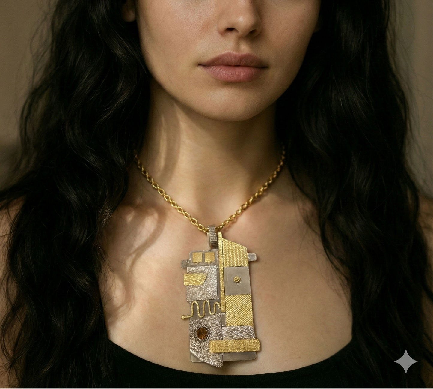 Woman wearing a gold necklace with a large pendant against a neutral background